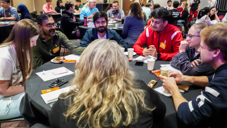 MARVEL Workshop participants at table working as a team to solve puzzle